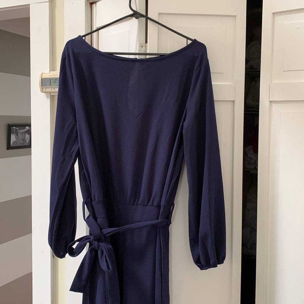 Long sleeve navy blue jumpsuit with tie- waist never worn.